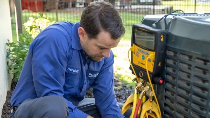 Polestar technician performing repairs on AC unit.