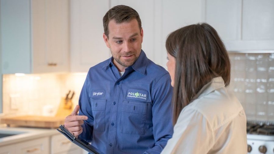 Technician reviewing boiler options.