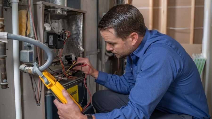Polestar tech working on gas furnace repair.