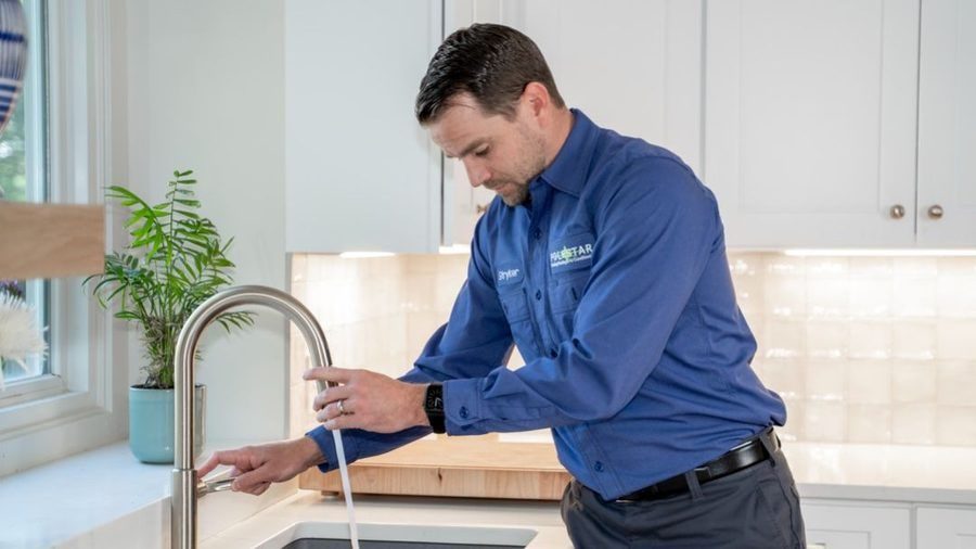 Polestar plumber testing faucet after pluming repair.